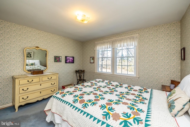 bedroom featuring wallpapered walls and carpet