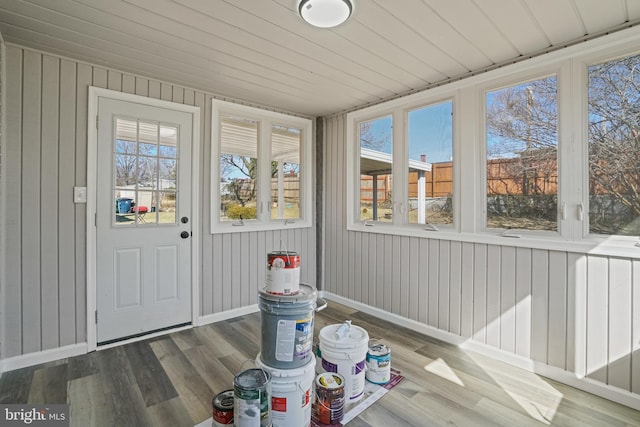 sunroom / solarium featuring wood ceiling