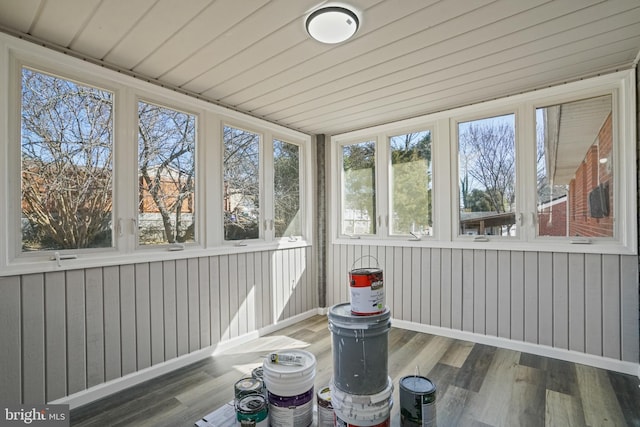 unfurnished sunroom with wooden ceiling