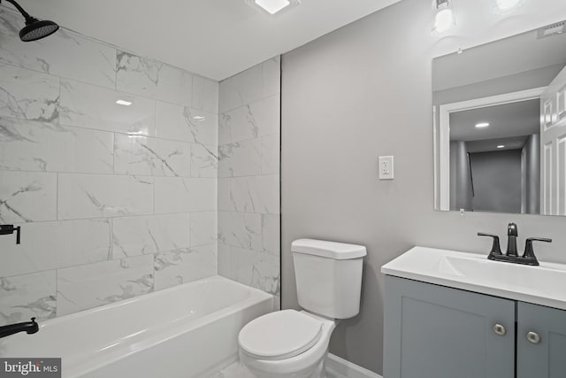 full bathroom featuring visible vents, toilet, tub / shower combination, vanity, and baseboards