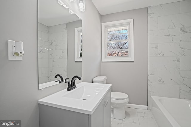 full bathroom with marble finish floor, toilet, washtub / shower combination, vanity, and baseboards