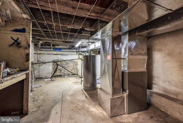 unfinished basement with heating unit and gas water heater