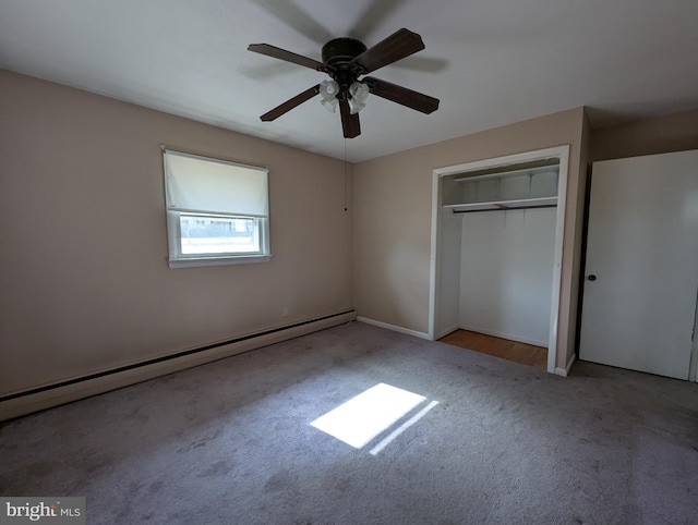 unfurnished bedroom with ceiling fan, a baseboard heating unit, a closet, and light colored carpet