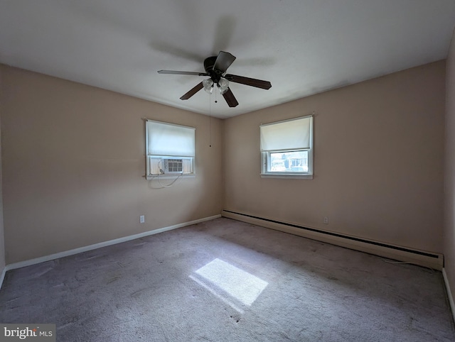 empty room featuring plenty of natural light, a baseboard radiator, baseboards, and carpet