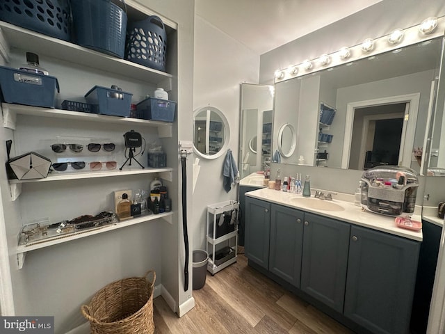 bathroom featuring vanity and wood finished floors