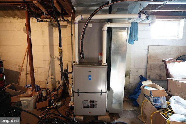 utility room with heating unit