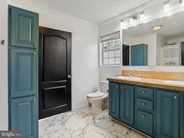 bathroom with marble finish floor, ornamental molding, a sink, and toilet