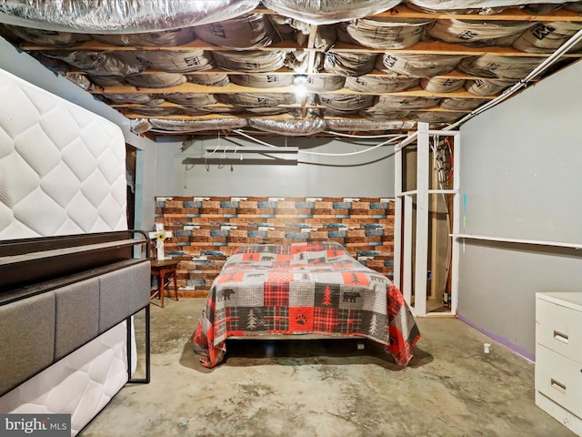 bedroom with unfinished concrete floors