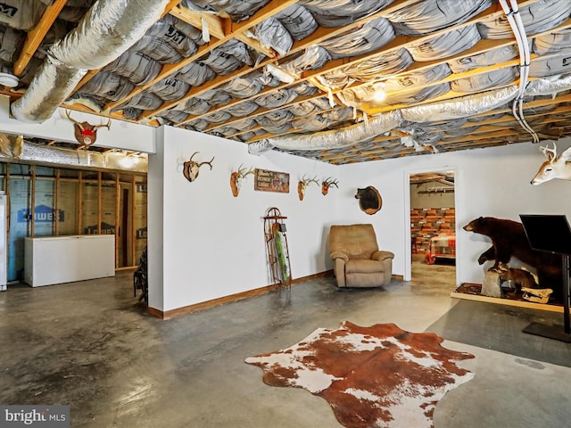 unfinished basement featuring baseboards