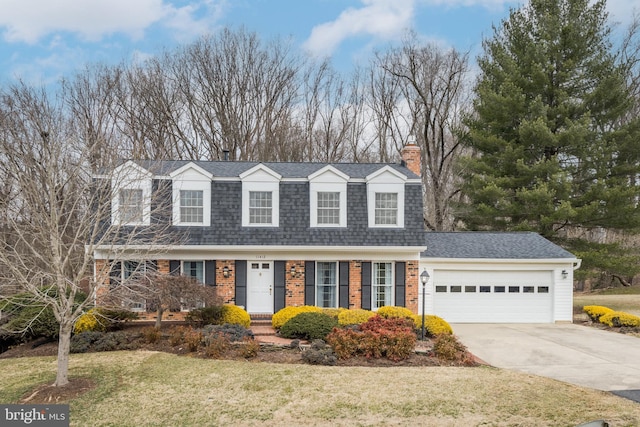 dutch colonial featuring a garage, concrete driveway, brick siding, and a shingled roof