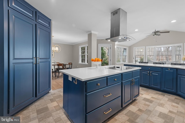 kitchen featuring a center island, blue cabinets, island exhaust hood, black electric stovetop, and light countertops