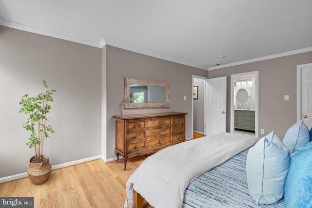 bedroom with ornamental molding, light wood finished floors, connected bathroom, and baseboards