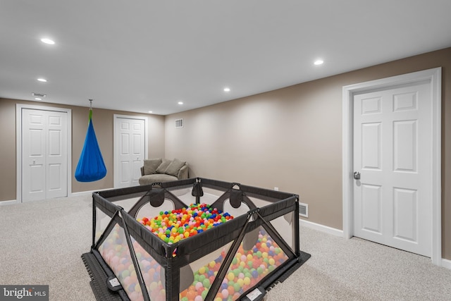 game room with carpet floors, recessed lighting, visible vents, and baseboards