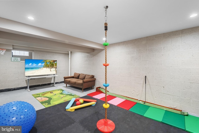 game room with finished concrete floors and recessed lighting