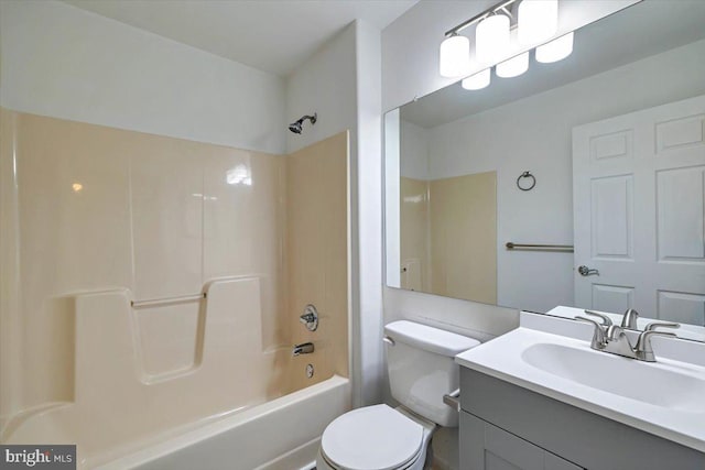 full bathroom with bathing tub / shower combination, toilet, and vanity