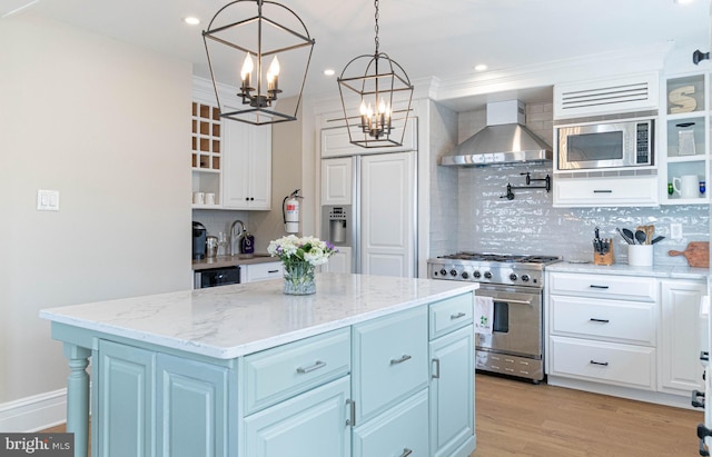 kitchen with appliances with stainless steel finishes, wall chimney range hood, open shelves, white cabinetry, and a kitchen island