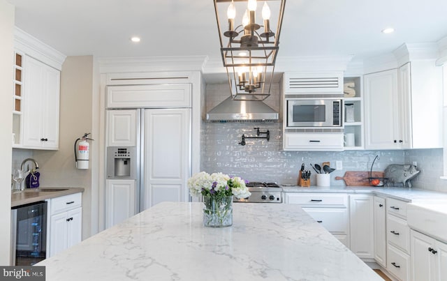 kitchen with white cabinetry and pendant lighting