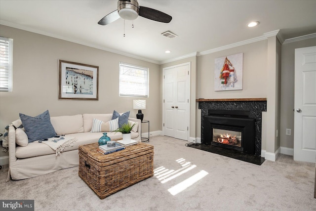 living area featuring carpet, crown molding, baseboards, and visible vents