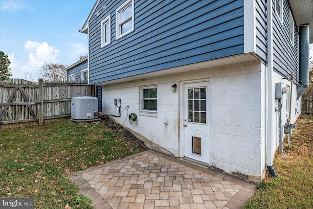 exterior space with fence, a patio area, and a yard