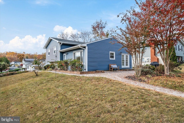 view of home's exterior featuring a yard