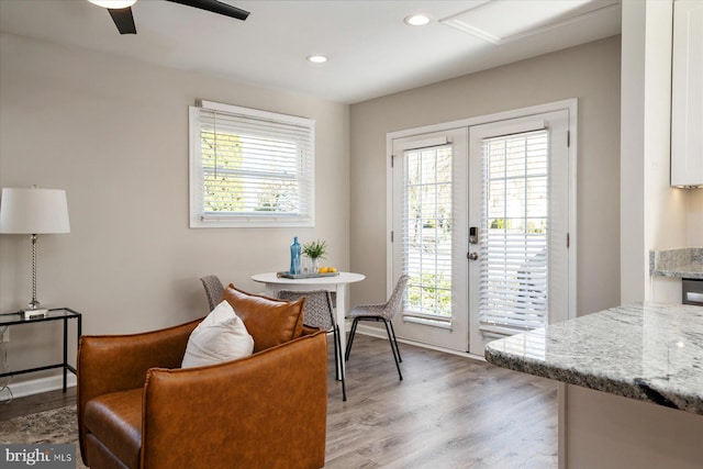 dining space with a healthy amount of sunlight, french doors, recessed lighting, and light wood-style floors