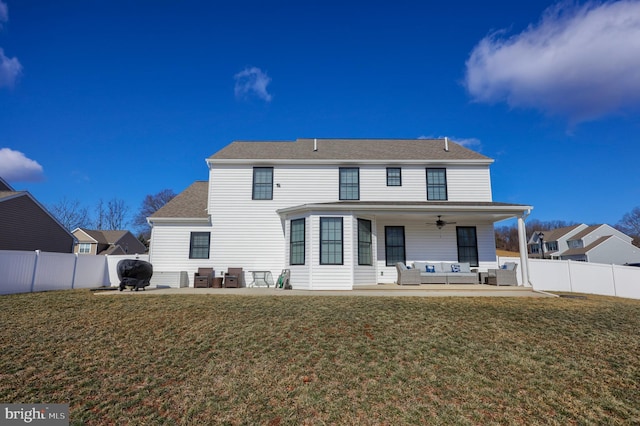 back of house with an outdoor hangout area, a patio, a yard, and a fenced backyard