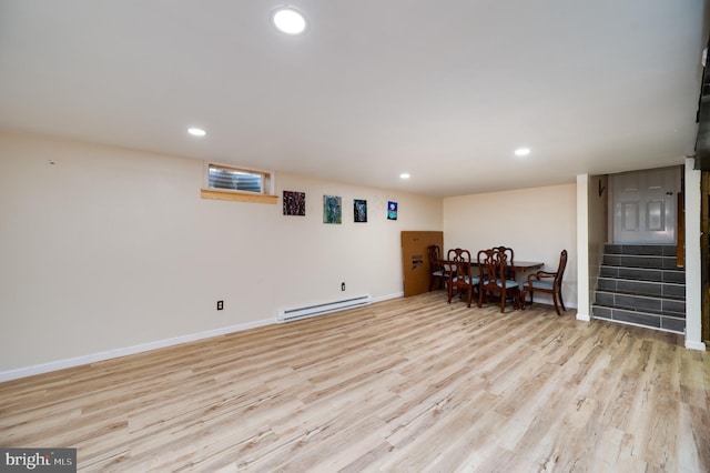 dining area featuring baseboard heating, light wood finished floors, and recessed lighting