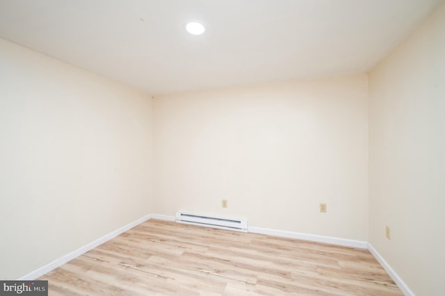 unfurnished room featuring baseboards, recessed lighting, a baseboard radiator, and light wood finished floors