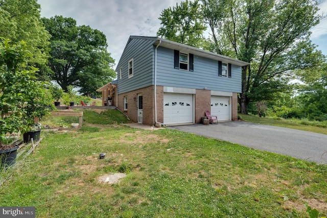 view of property exterior with brick siding, a lawn, driveway, and a garage