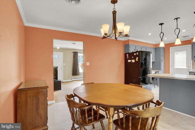 dining room with a baseboard radiator, baseboards, visible vents, and ornamental molding