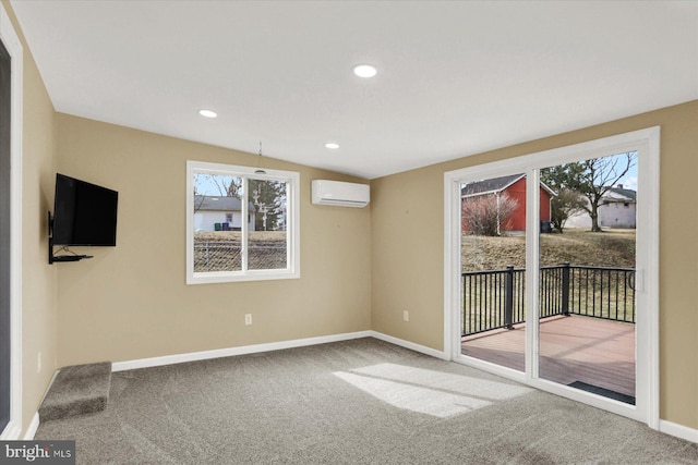 empty room with baseboards, lofted ceiling, a wall unit AC, carpet floors, and recessed lighting