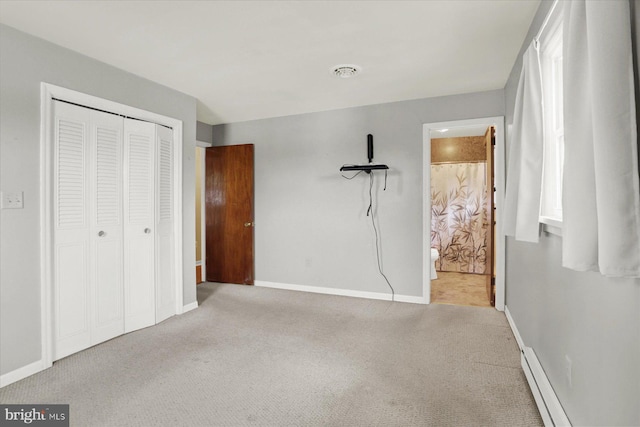 unfurnished bedroom featuring a closet, baseboards, carpet, and visible vents