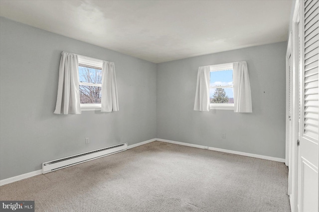 unfurnished bedroom with carpet, baseboards, a closet, and a baseboard radiator