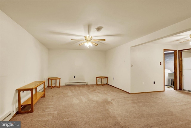 carpeted empty room with a ceiling fan, baseboards, baseboard heating, and a sink