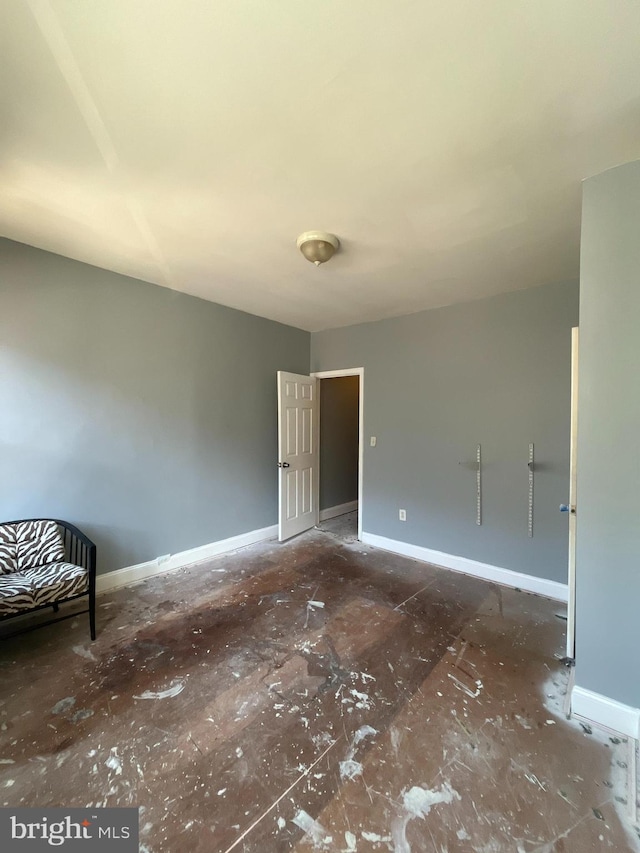 interior space featuring baseboards