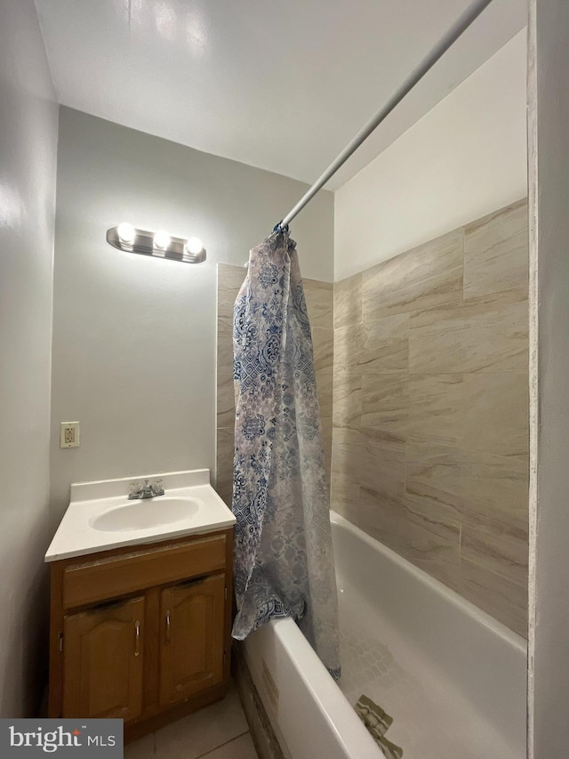 full bath featuring shower / bath combo with shower curtain and vanity