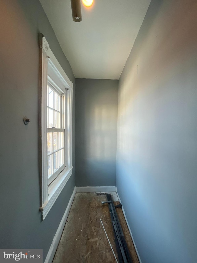 interior space featuring baseboards and visible vents