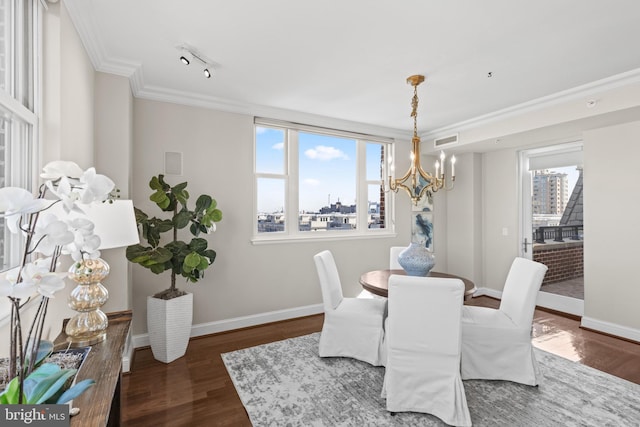 dining space featuring dark wood-style floors, visible vents, crown molding, and baseboards