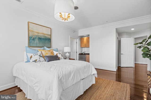 bedroom with dark wood-type flooring, ornamental molding, and baseboards