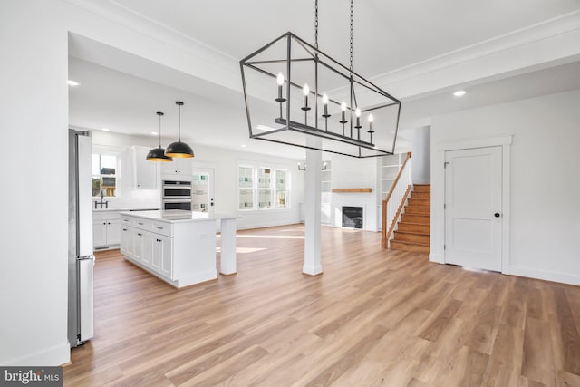 unfurnished living room with light hardwood / wood-style floors