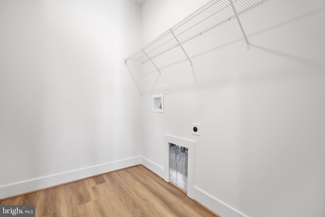 laundry room with hookup for an electric dryer, washer hookup, and hardwood / wood-style flooring