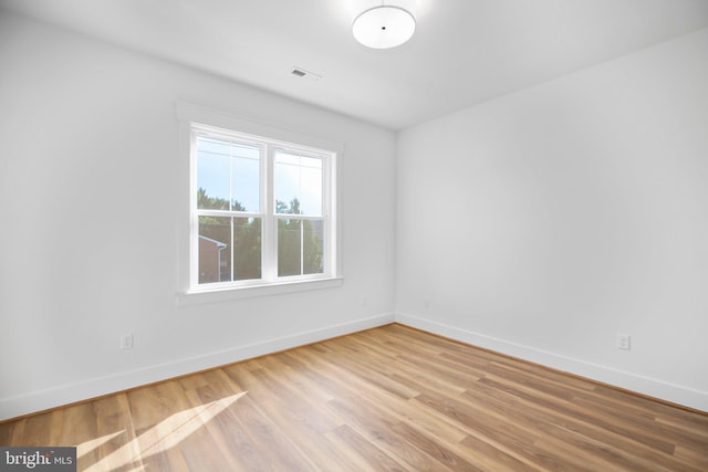 empty room featuring wood-type flooring