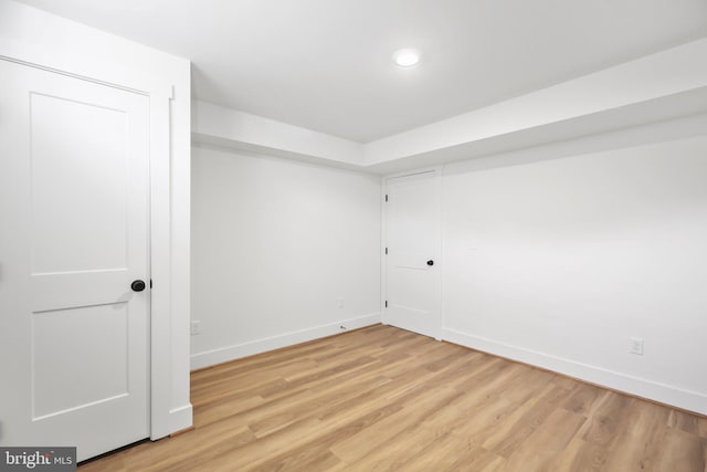 empty room with light hardwood / wood-style floors