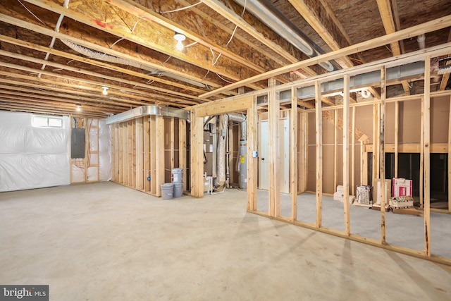 basement with water heater and electric panel