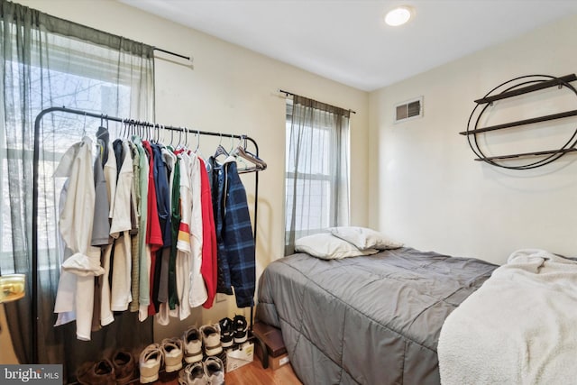 bedroom with hardwood / wood-style floors