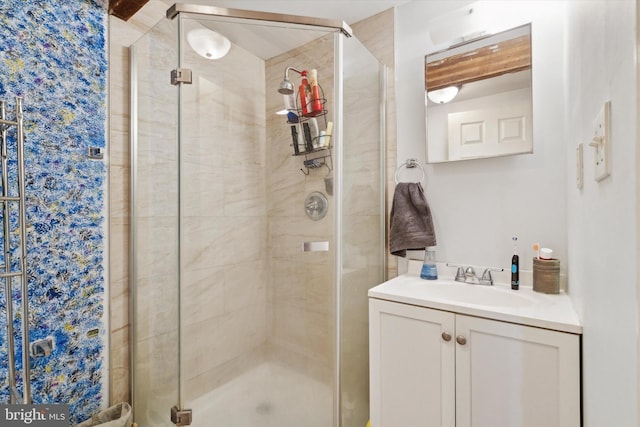 bathroom featuring an enclosed shower and vanity