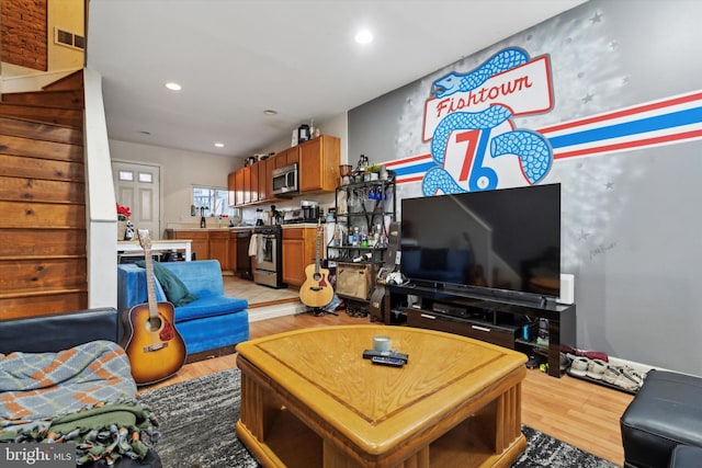 living room with light hardwood / wood-style flooring