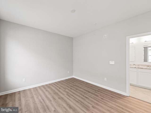 14 Bowers Dr Unit 3, Ocean View, DE 19970 - interior space with baseboards, connected bathroom, and light wood-style floors