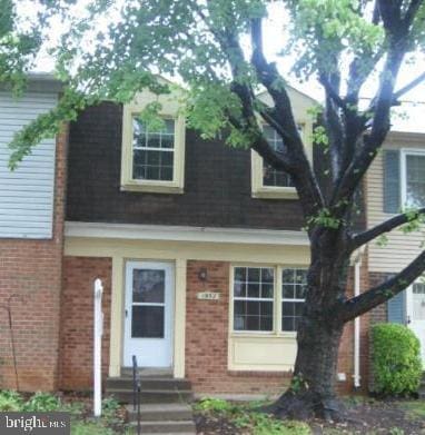 view of front of property with brick siding and entry steps