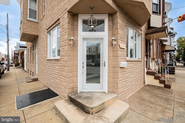 entrance to property with stone siding